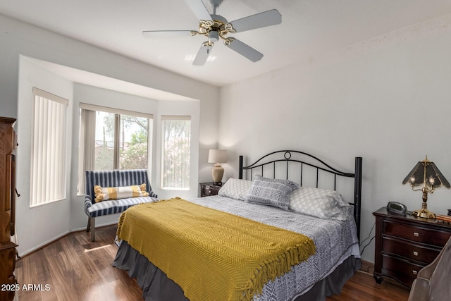 16331 W Tierra Way, Surprise, AZ 85374 - bedroom with baseboards, wood finished floors, and a ceiling fan