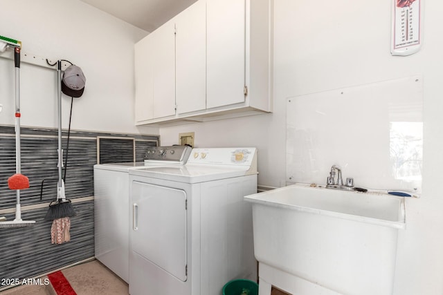16331 W Tierra Way, Surprise, AZ 85374 - clothes washing area featuring washer and dryer, cabinet space, and a sink