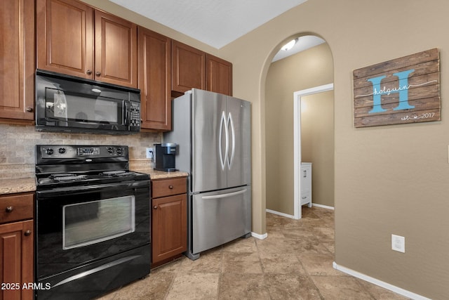 3828 S Verbena Ave, Gilbert, AZ 85297 - kitchen with baseboards, decorative backsplash, brown cabinetry, and black appliances