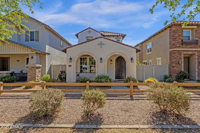 3828 S Verbena Ave, Gilbert, AZ 85297 - mediterranean / spanish-style home with a fenced front yard and stucco siding
