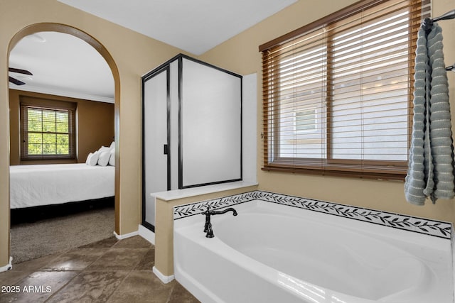 3828 S Verbena Ave, Gilbert, AZ 85297 - full bathroom featuring crown molding, baseboards, connected bathroom, a bath, and a shower stall