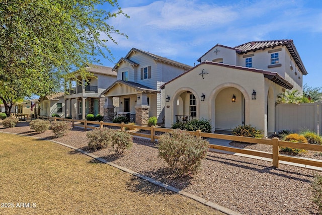 3828 S Verbena Ave, Gilbert, AZ 85297 - mediterranean / spanish-style house with stucco siding, fence private yard, and stone siding
