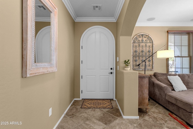3828 S Verbena Ave, Gilbert, AZ 85297 - foyer featuring arched walkways, baseboards, visible vents, and ornamental molding