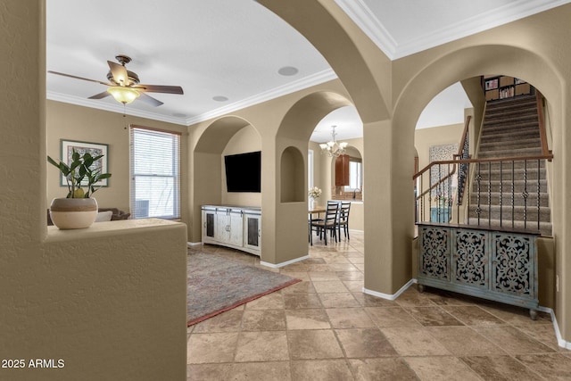 3828 S Verbena Ave, Gilbert, AZ 85297 - foyer with crown molding, arched walkways, and stone tile flooring
