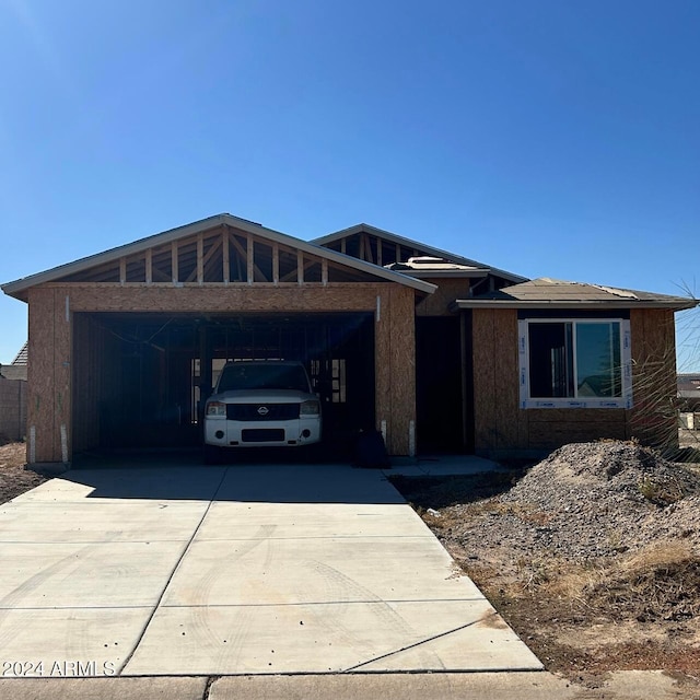 view of front of property featuring a carport