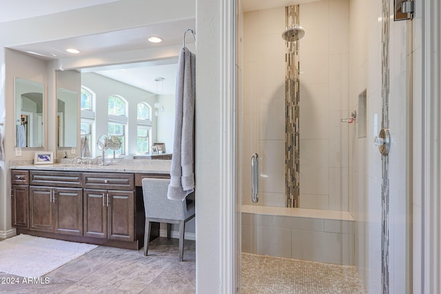 full bath with recessed lighting, a tile shower, and vanity