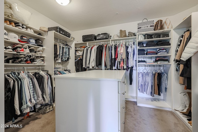 walk in closet featuring carpet