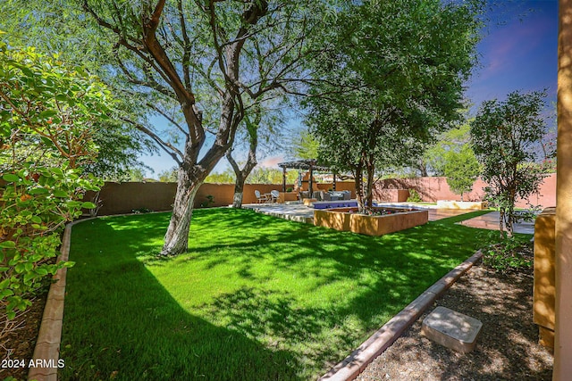 view of yard featuring a patio, a fenced backyard, and a pergola