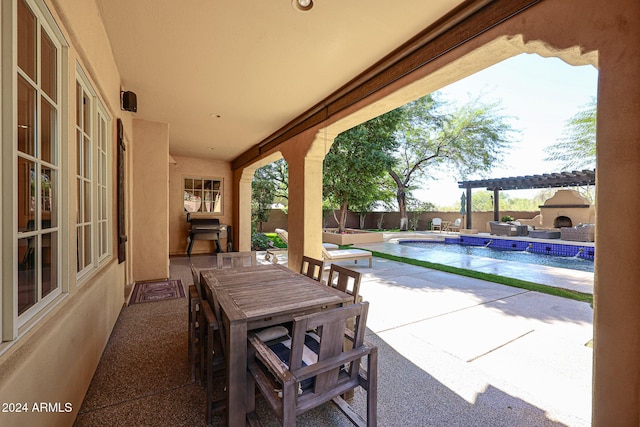 view of patio featuring a fenced in pool, outdoor dining space, and a fenced backyard