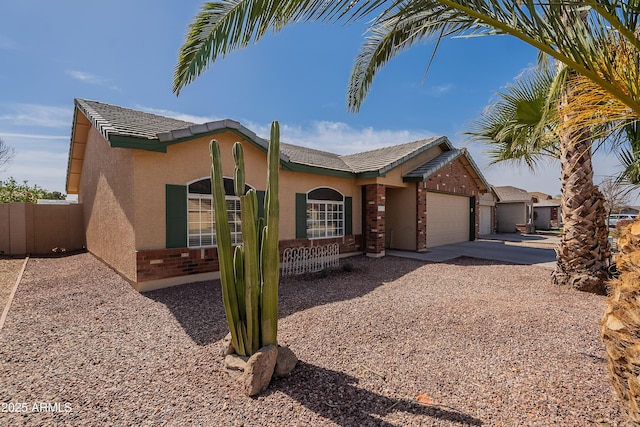 single story home with stucco siding, fence, a garage, driveway, and a tiled roof