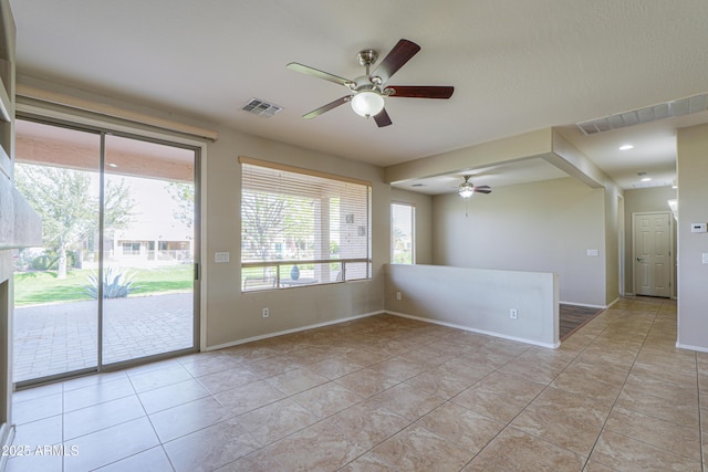 unfurnished room featuring ceiling fan and light tile patterned flooring