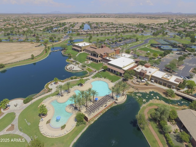 birds eye view of property with a water view