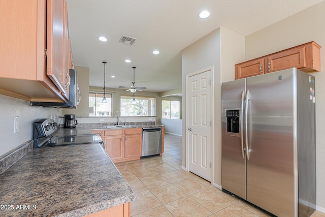 kitchen with stainless steel appliances, sink, hanging light fixtures, ceiling fan, and light tile patterned floors