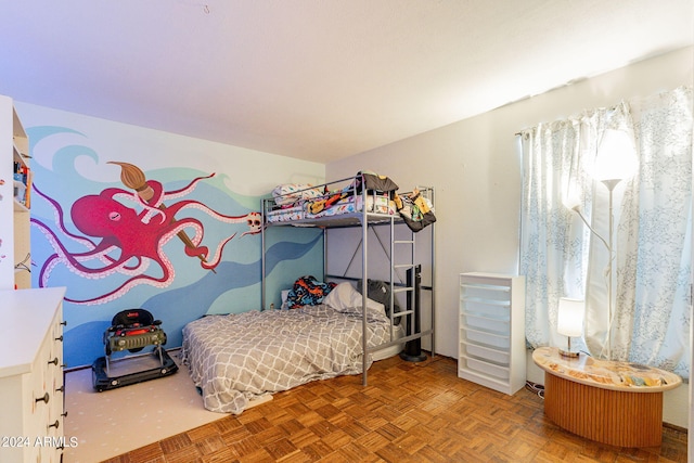 bedroom featuring parquet flooring