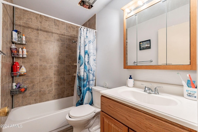 full bathroom featuring shower / bath combo, vanity, and toilet