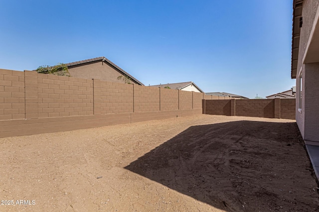 view of yard with a fenced backyard