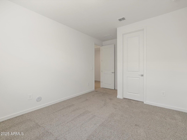 unfurnished bedroom featuring carpet flooring, baseboards, and visible vents