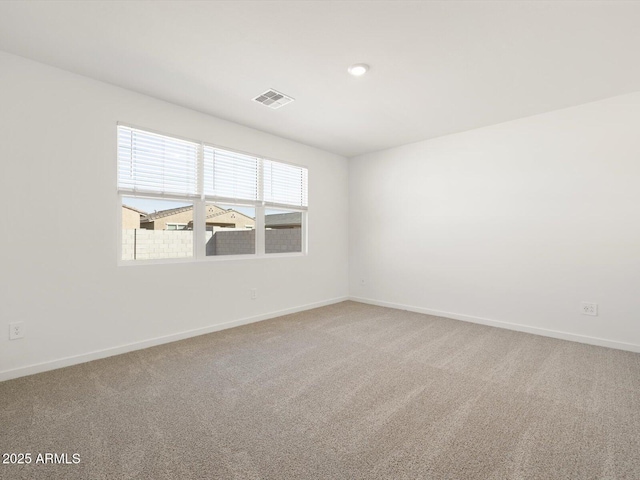 unfurnished room featuring carpet flooring, recessed lighting, baseboards, and visible vents