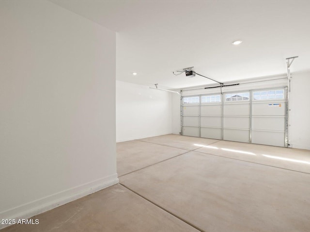 garage with baseboards, a garage door opener, and recessed lighting