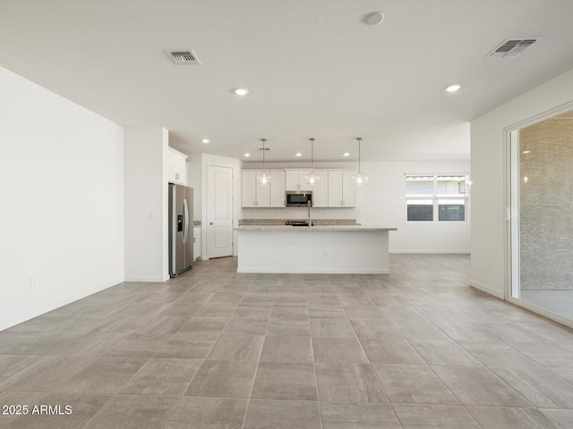 kitchen featuring stainless steel appliances, recessed lighting, white cabinetry, and visible vents