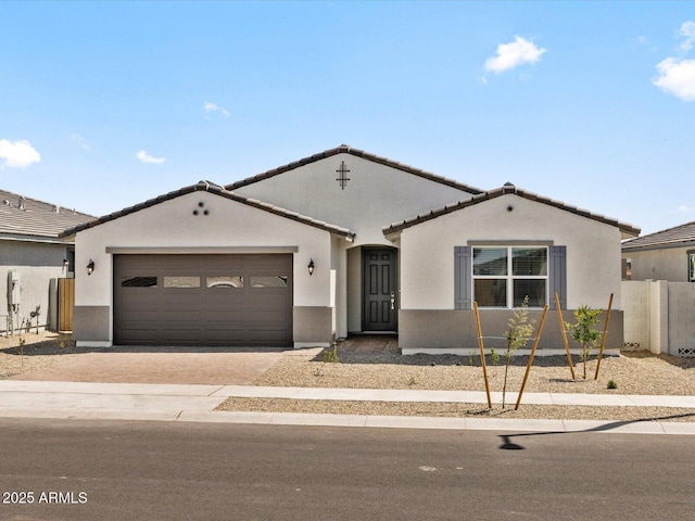 4035 S 176th Dr, Goodyear, AZ 85338 - mediterranean / spanish home with driveway, an attached garage, stucco siding, and a tile roof