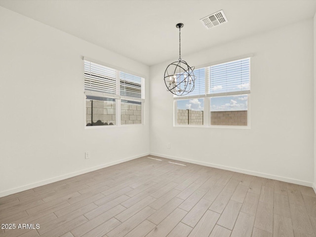 4035 S 176th Dr, Goodyear, AZ 85338 - spare room featuring a chandelier and light wood finished floors