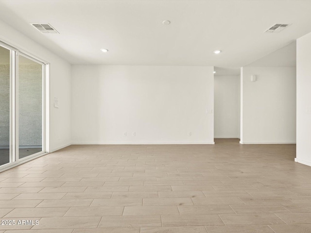 4035 S 176th Dr, Goodyear, AZ 85338 - empty room featuring light wood-style floors, recessed lighting, and healthy amount of natural light