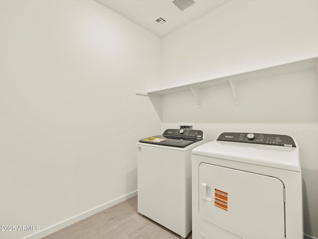 4035 S 176th Dr, Goodyear, AZ 85338 - washroom featuring independent washer and dryer and light wood finished floors