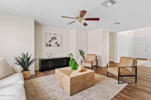 2286 E Mohave Ln, Apache Junction, AZ 85119 - living area featuring wood finished floors, ceiling fan, and baseboards