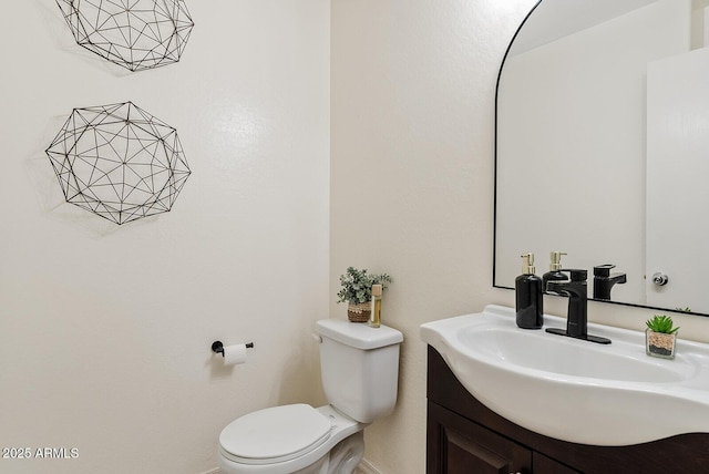 2286 E Mohave Ln, Apache Junction, AZ 85119 - half bathroom featuring toilet, baseboards, and vanity