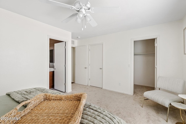 2286 E Mohave Ln, Apache Junction, AZ 85119 - bedroom with light colored carpet, a spacious closet, a ceiling fan, a closet, and ensuite bath