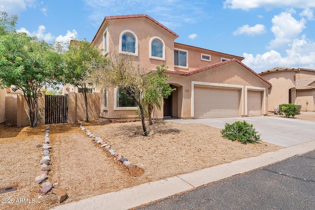 2286 E Mohave Ln, Apache Junction, AZ 85119 - mediterranean / spanish house featuring driveway, stucco siding, and an attached garage