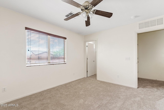 2286 E Mohave Ln, Apache Junction, AZ 85119 - unfurnished bedroom featuring light colored carpet, baseboards, and ceiling fan