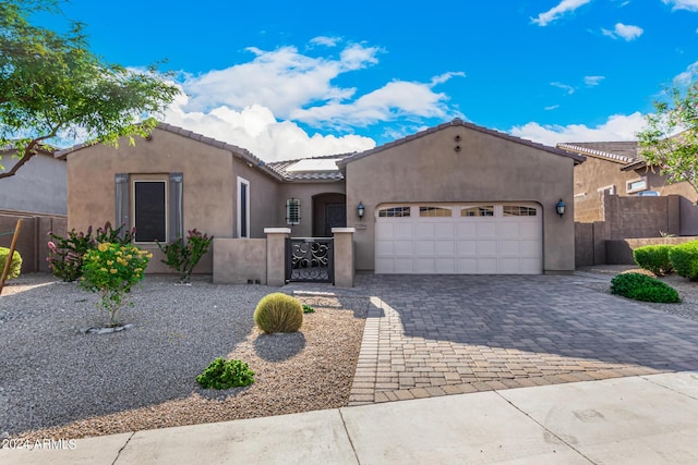 view of front of property featuring a garage