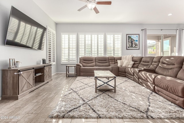 living room with ceiling fan