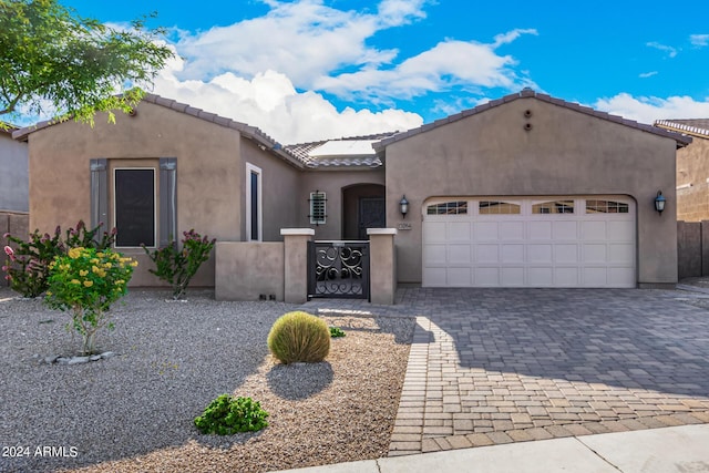 view of front of property with a garage