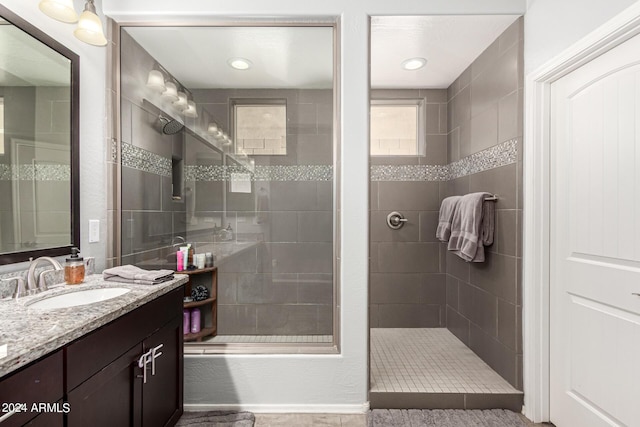 bathroom featuring vanity and a tile shower