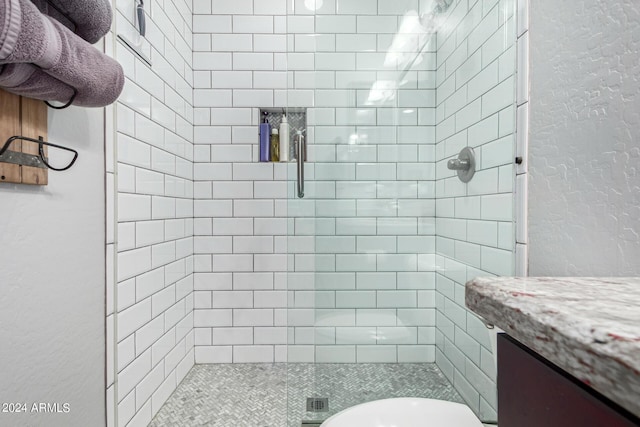 bathroom featuring walk in shower, vanity, and toilet