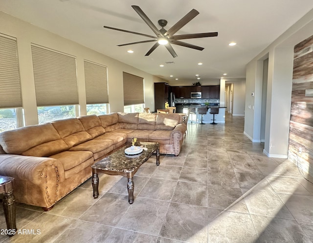 living room featuring ceiling fan