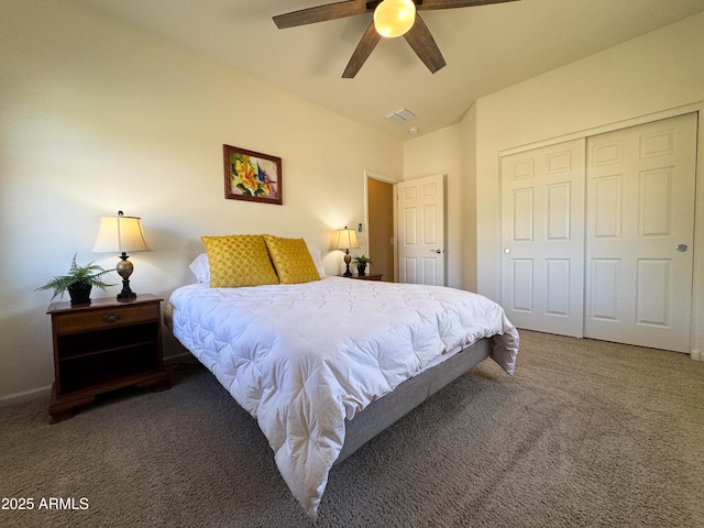 bedroom with ceiling fan, carpet, and a closet