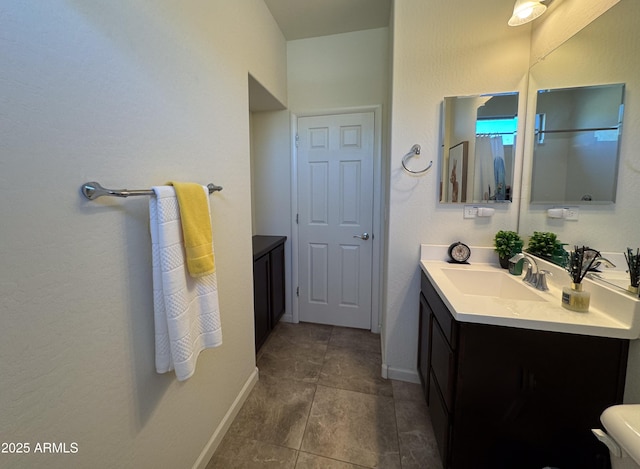 bathroom featuring tile patterned flooring and vanity