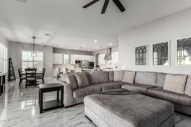 living room with ceiling fan