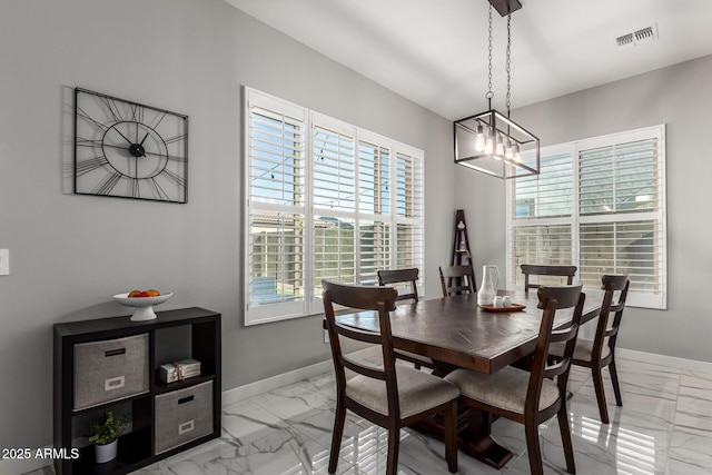 dining area with a chandelier