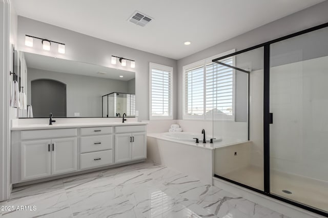 bathroom with shower with separate bathtub and vanity