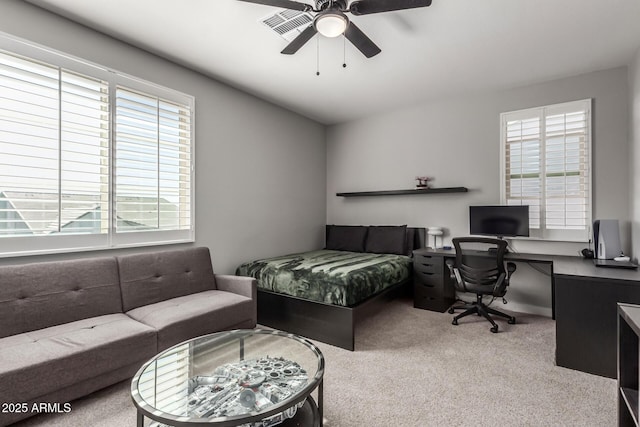 bedroom with ceiling fan and carpet flooring