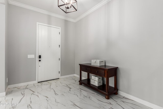 foyer featuring ornamental molding and an inviting chandelier