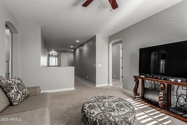 living room featuring ceiling fan and light colored carpet