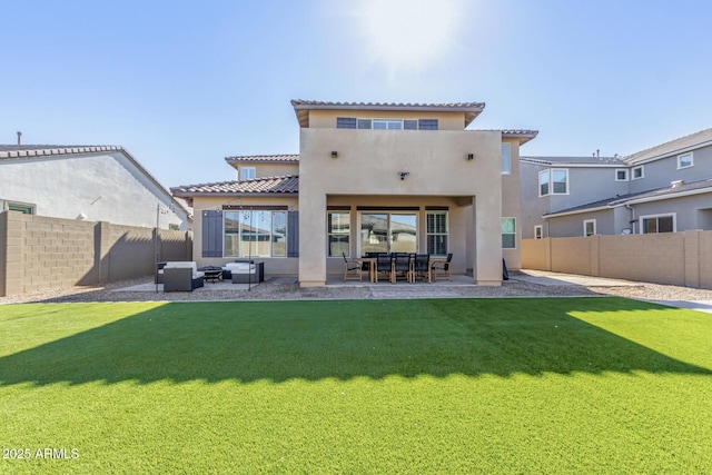 back of house with a lawn, outdoor lounge area, and a patio