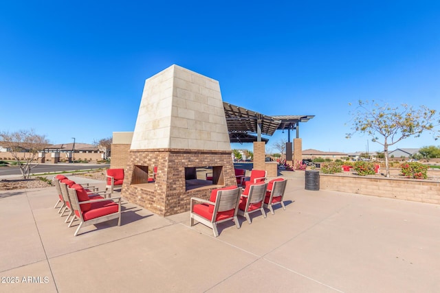 view of patio featuring a multi sided fireplace