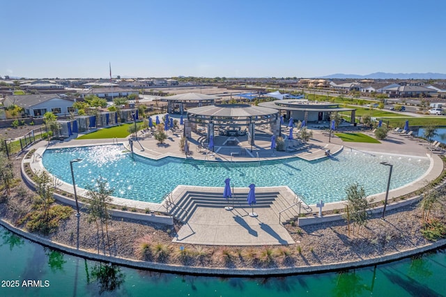 view of pool featuring a patio area and a mountain view